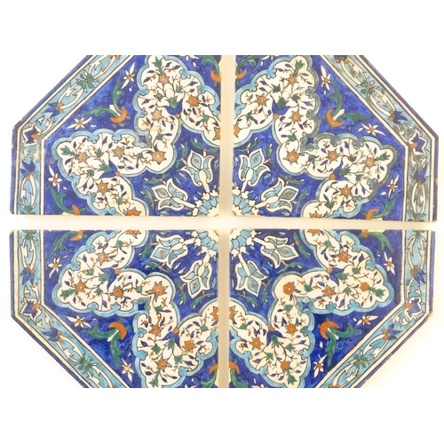 105 - Four Eastern tiles with iznik style floral and foliate decoration, forming an octagon. Each tile app... 