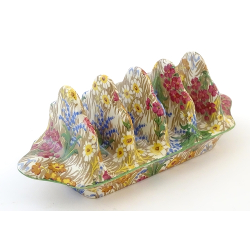 107 - A Royal Winton five bar toast rack in the floral pattern Marguerite. Marked under. Approx. 7