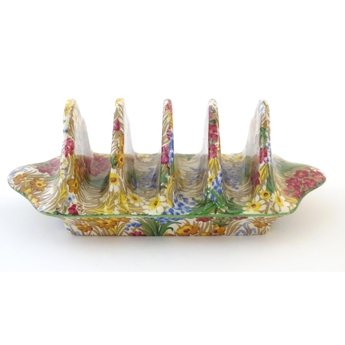 107 - A Royal Winton five bar toast rack in the floral pattern Marguerite. Marked under. Approx. 7