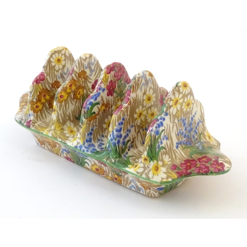 107 - A Royal Winton five bar toast rack in the floral pattern Marguerite. Marked under. Approx. 7