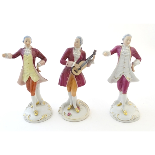 110 - Three Royal Dux figures modelled as an 18th century gentleman, one with a string instrument. Marked ... 