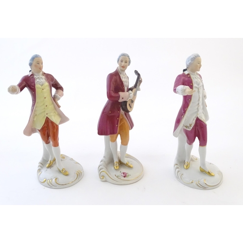 110 - Three Royal Dux figures modelled as an 18th century gentleman, one with a string instrument. Marked ... 