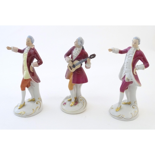 110 - Three Royal Dux figures modelled as an 18th century gentleman, one with a string instrument. Marked ... 