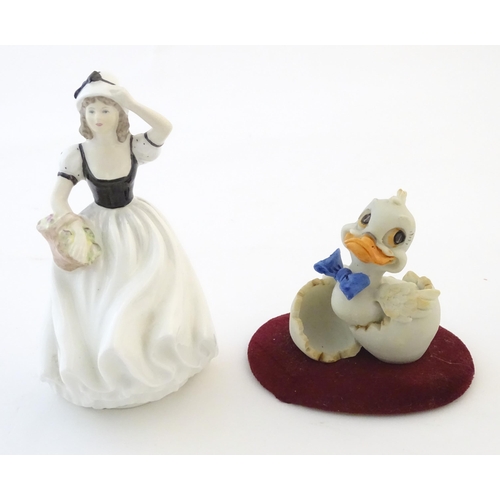 112 - A Coalport model of a lady, Susan. Together with a Capodimonte model of a duck with a blue bow tie. ... 