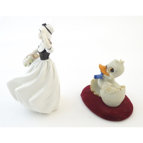 112 - A Coalport model of a lady, Susan. Together with a Capodimonte model of a duck with a blue bow tie. ... 