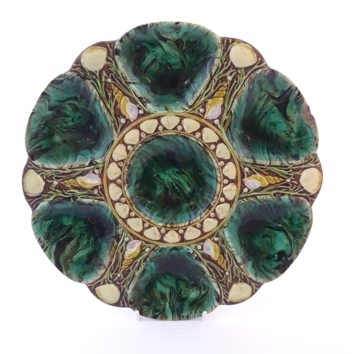 115 - A Victorian Minton majolica oyster plate with relief shell decoration. Impressed marks under. Approx... 