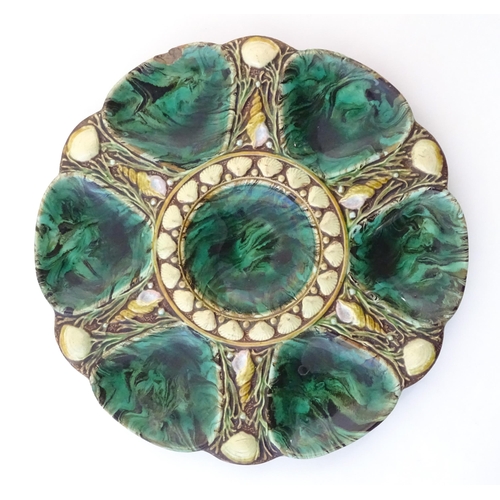 115 - A Victorian Minton majolica oyster plate with relief shell decoration. Impressed marks under. Approx... 