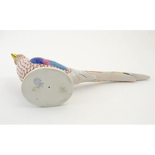 120 - A Herend pottery model of a pheasant with fishnet decoration and gilt highlights. Marked under. Appr... 