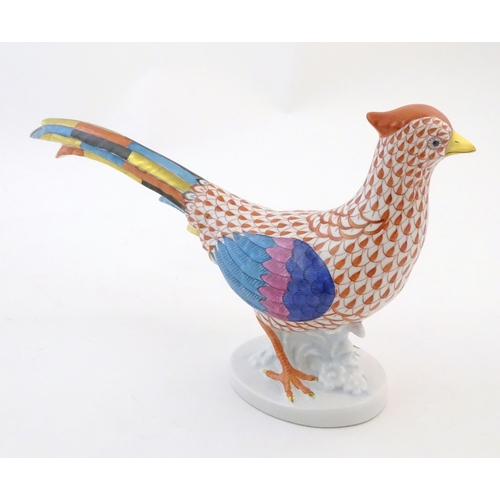 120 - A Herend pottery model of a pheasant with fishnet decoration and gilt highlights. Marked under. Appr... 