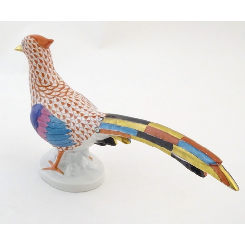 120 - A Herend pottery model of a pheasant with fishnet decoration and gilt highlights. Marked under. Appr... 