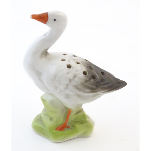 126 - A Continental hat pin holder modelled as a goose. Approx. 4