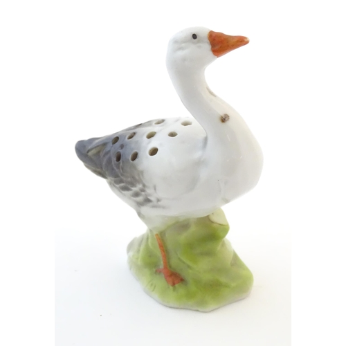 126 - A Continental hat pin holder modelled as a goose. Approx. 4