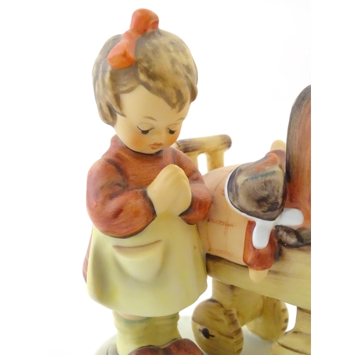 130 - A Hummel / Goebel figure, Doll Mother, model no. 67. Marked under and hand signed and dated 28/11/99... 