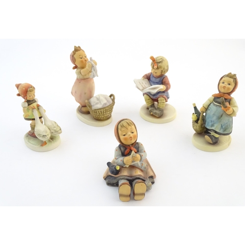 133 - Five Hummel / Goebel figures comprising Happy Pastime, no. 69, What's New?, no. 418, Goose Girl, no.... 