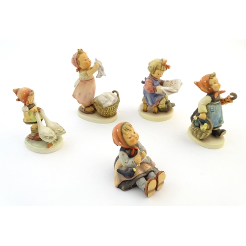 133 - Five Hummel / Goebel figures comprising Happy Pastime, no. 69, What's New?, no. 418, Goose Girl, no.... 