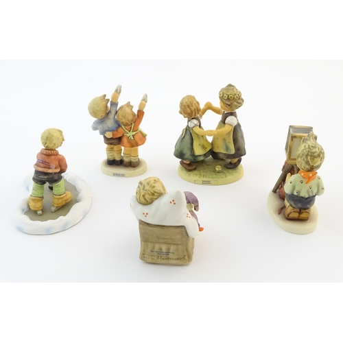 139 - Five Hummel / Goebel figures comprising The Photographer, no. 178, Let's Take to the Ice, no. 2143, ... 