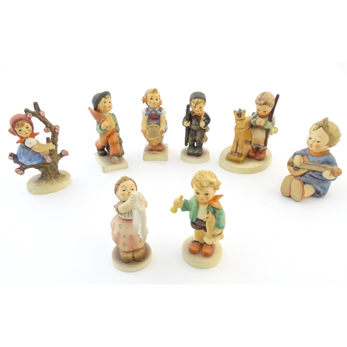 141 - Eight Hummel / Goebel figures comprising Merry Wanderer, no. 11, Chimney Sweep, no. 12, Apple Tree G... 