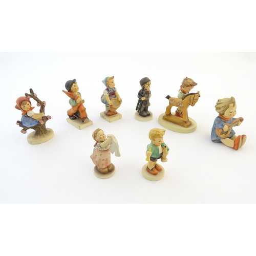 141 - Eight Hummel / Goebel figures comprising Merry Wanderer, no. 11, Chimney Sweep, no. 12, Apple Tree G... 