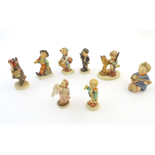 141 - Eight Hummel / Goebel figures comprising Merry Wanderer, no. 11, Chimney Sweep, no. 12, Apple Tree G... 