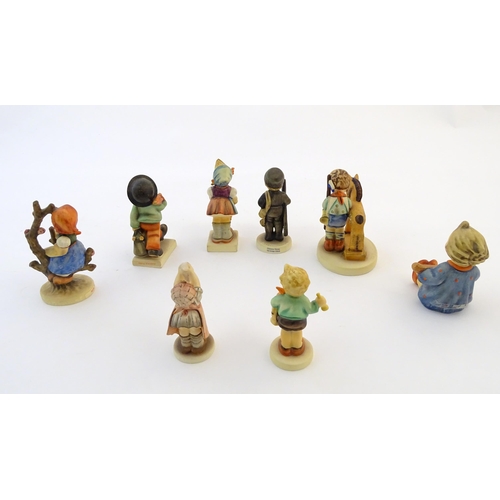 141 - Eight Hummel / Goebel figures comprising Merry Wanderer, no. 11, Chimney Sweep, no. 12, Apple Tree G... 