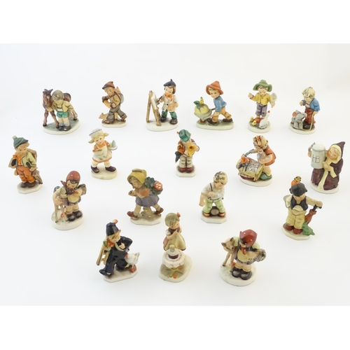 144 - A quantity of Friedel figures to include an artist with palette and easel, a farm boy with a wheelba... 