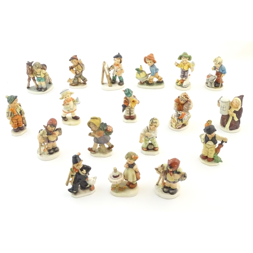 144 - A quantity of Friedel figures to include an artist with palette and easel, a farm boy with a wheelba... 