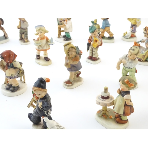 144 - A quantity of Friedel figures to include an artist with palette and easel, a farm boy with a wheelba... 