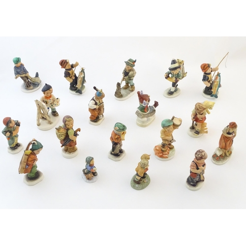 145 - A quantity of Friedel figures to include a boy playing the cello, an artist with easel and palette, ... 