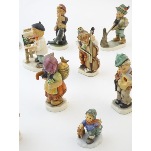 145 - A quantity of Friedel figures to include a boy playing the cello, an artist with easel and palette, ... 