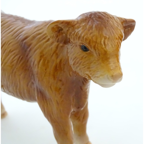 146 - A John Beswick model of a Highland cow, together with a John Beswick Highland calf. Marked under. La... 