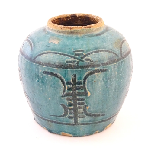 21 - A Chinese ginger jar / vase with a turquoise glaze and character mark decoration. Approx. 7 1/2