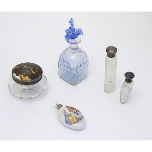 268 - Assorted scent perfume flasks to include a two cut glass flasks with silver tops, a scent bottle wit... 