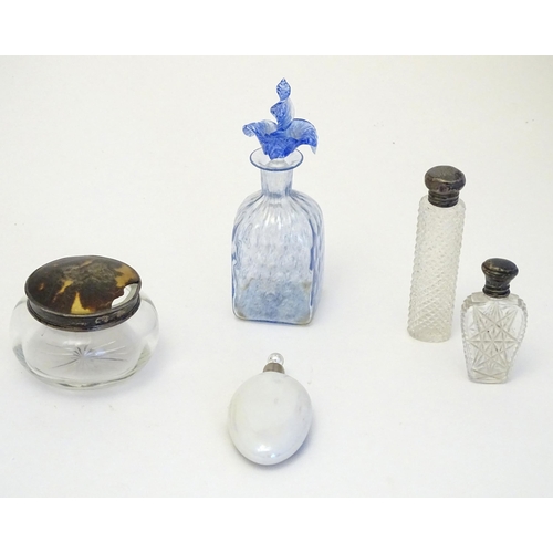 268 - Assorted scent perfume flasks to include a two cut glass flasks with silver tops, a scent bottle wit... 