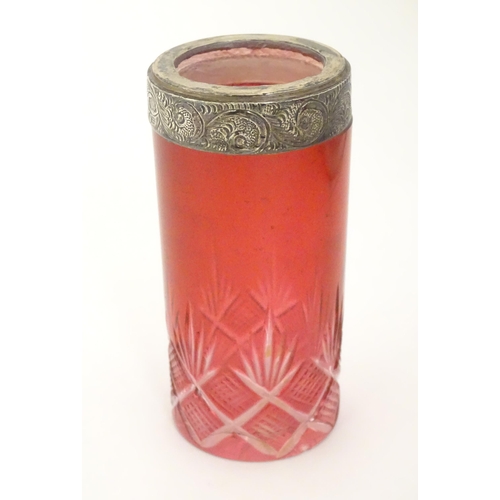 276 - A cut glass vase / spill vase with cranberry detail and silver rim. Approx 4 1/4