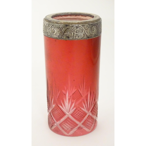 276 - A cut glass vase / spill vase with cranberry detail and silver rim. Approx 4 1/4