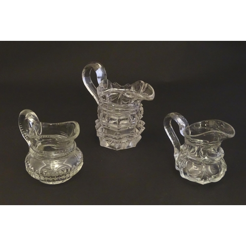 287 - Three assorted glass cream jugs. The tallest approx 5