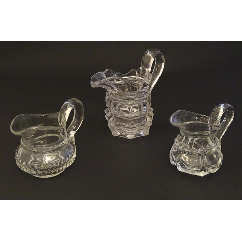 287 - Three assorted glass cream jugs. The tallest approx 5