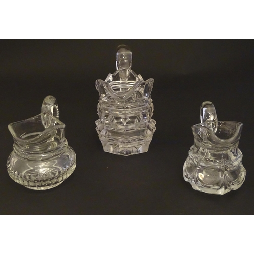 287 - Three assorted glass cream jugs. The tallest approx 5