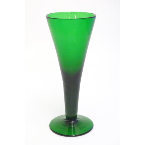 289 - A studio green glass vase of conical form with pedestal base 11 1/4