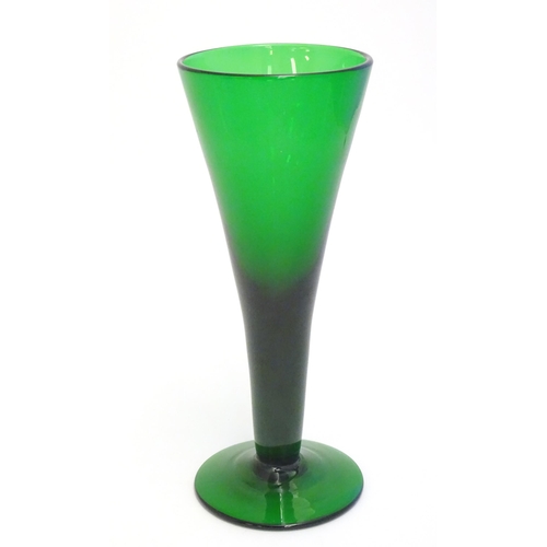 289 - A studio green glass vase of conical form with pedestal base 11 1/4