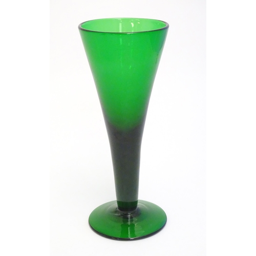 289 - A studio green glass vase of conical form with pedestal base 11 1/4