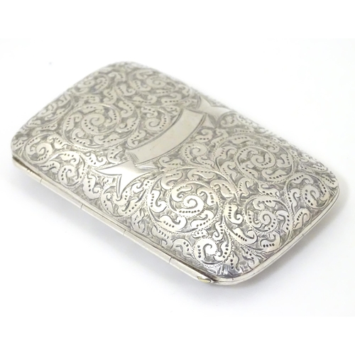 312 - A Victorian silver cigarette case with engraved decoration, hallmarked Birmingham 1894 maker Minshul... 