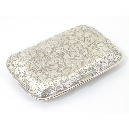 312 - A Victorian silver cigarette case with engraved decoration, hallmarked Birmingham 1894 maker Minshul... 