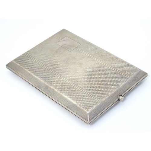 314 - An Art Deco silver cigarette case with engine turned and banded decoration.  Hallmarked Birmingham  ... 