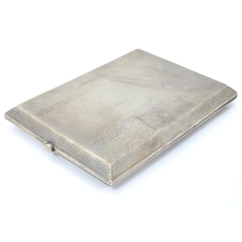 314 - An Art Deco silver cigarette case with engine turned and banded decoration.  Hallmarked Birmingham  ... 