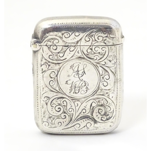 323 - A silver vesta case with engraved decoration, hallmarked Birmingham 1911 maker John Edward Wilmot. 1... 