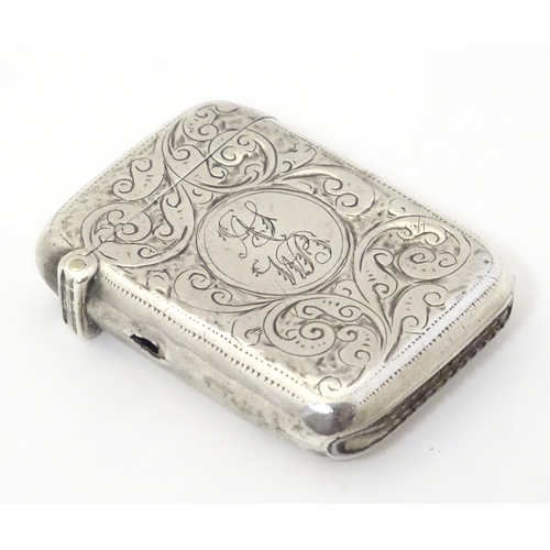 323 - A silver vesta case with engraved decoration, hallmarked Birmingham 1911 maker John Edward Wilmot. 1... 