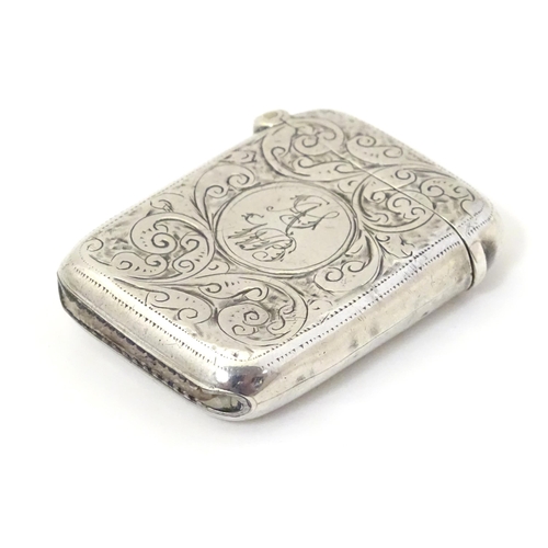 323 - A silver vesta case with engraved decoration, hallmarked Birmingham 1911 maker John Edward Wilmot. 1... 