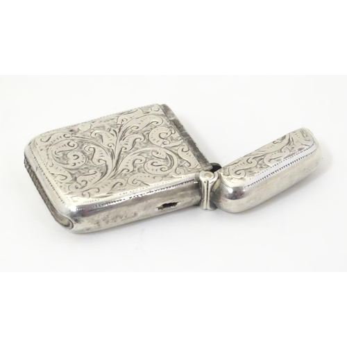 323 - A silver vesta case with engraved decoration, hallmarked Birmingham 1911 maker John Edward Wilmot. 1... 