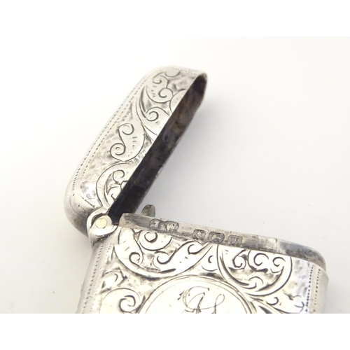 323 - A silver vesta case with engraved decoration, hallmarked Birmingham 1911 maker John Edward Wilmot. 1... 